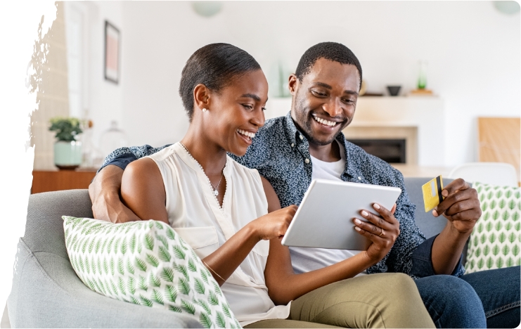 couple-looking-at-tablet-with-card